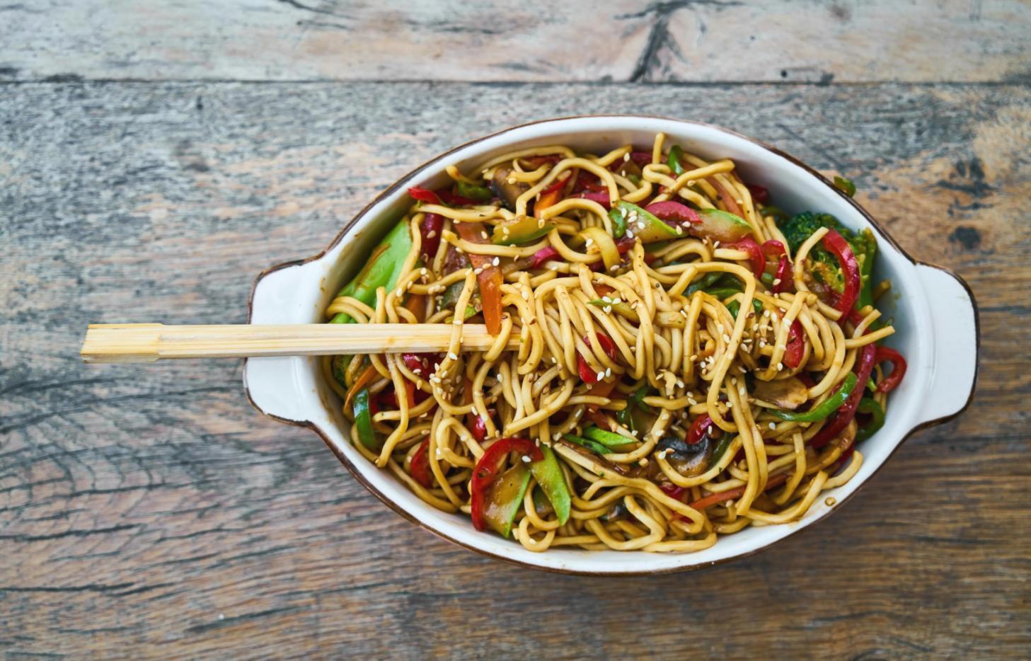 Fresh pizza preparation in our kitchen with toppings arranged for an upcoming Montreal corporate event